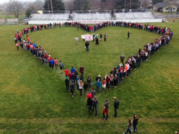 Taken by Michelle Zundel, students gather to make a heart